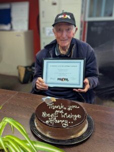 Harry Owens PBA FM radio veteran with his certificate of appreciation and farewell cake